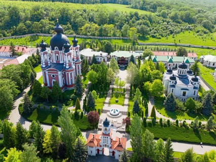 Orthodox monastery with ornate architecture and greenery, nestled in nature, aerial view, Cathedral
