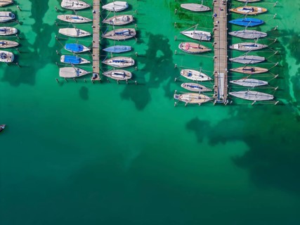 Marina of the Yacht Club Insel Reichenau. The lake bed can be seen in many shallow water zones. The
