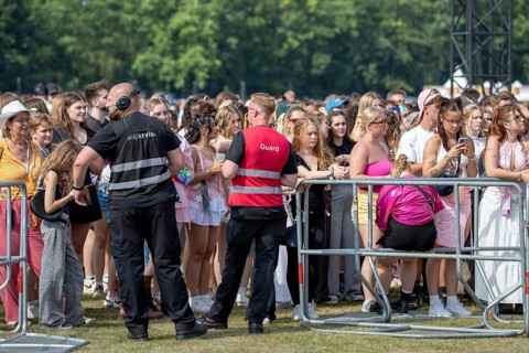 Festival visitors behind breakwater at the Lollapalooza Festival on the Olympic Site, Berlin, 18.07