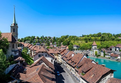Historic houses and alley Mattenenge with Nydegg church, Nydegg district and river Aare, Bern,