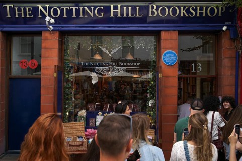Tourists, visitors, queue in front of The Notting Hill Bookshop from the movie Notting Hill,