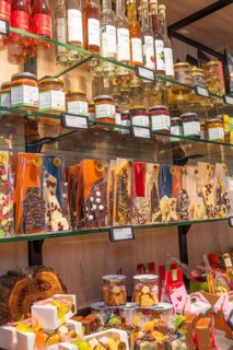 Mixed range of sweets and liqueurs on several glass shelves, Café Kuh, Deckenpfronn, Germany