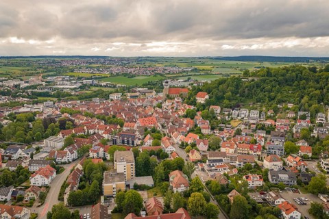 City landscape with old architecture and a church in the midst of rural surroundings, Herrenberg,