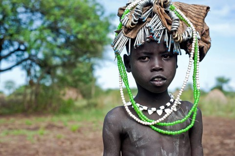 Portrait of a child from the Mursi tribe, Omo valley, Ethiopia
