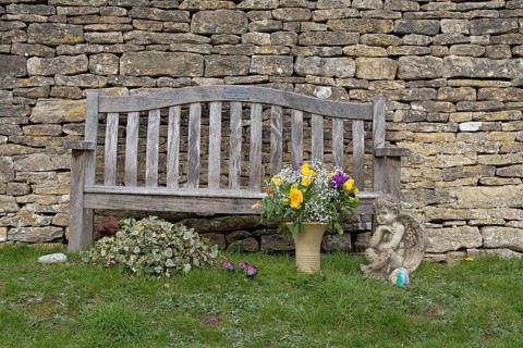 Stone wall, bench, flowers, cemetery, Bibury, The Cotswolds, England, Great Britain