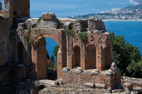 View of ruins of an ancient theatre and the Mediterranean Sea, Taormina, Sicily, Italy