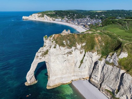 Aerial view of the Porte d'Aval rock formation, a landmark on the chalk coast with the distinctive