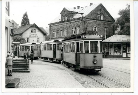 Bad Schandau, Saxony, city center, historic tram in front of old buildings in a city street scene,