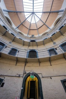Circular interior of a prison with a view of a skylight and lattice structures, Kilmainham Gaol