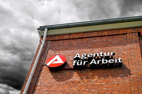 Sign from the employment agency in Bergedorf, Hamburg, Germany, photo montage +++ editorial use