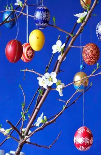 Easter, Easter bouquet with colorful Easter eggs, branches with flowers of an ornamental quince,