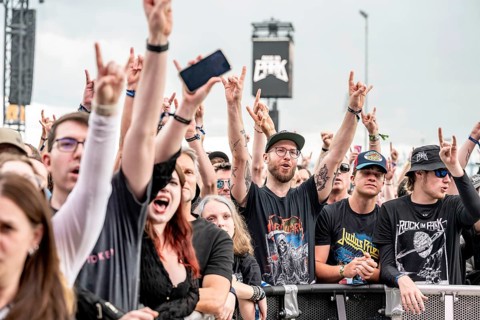 Festival visitors show metal gesture during Tom Morello's performance at Rock im Park on Zeppelin