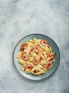 Tagliatelli with shrimp, in cream sauce, with parmesan cheese, homemade, no people, in