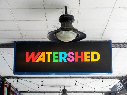 Colourful sign for Watershed independent cinema and cultural hub, city centre of Bristol, England,