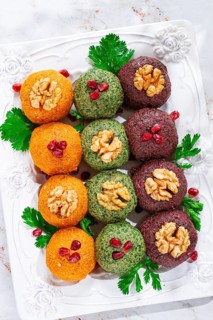 Assortment of Pkhali, pumpkin, spinach and beetroot, Georgian dish, on a white plate, appetizer
