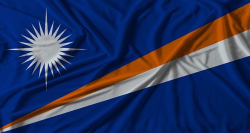 Marshall Islands flag with fabric texture background. National flag of Marshall Islands with cloth