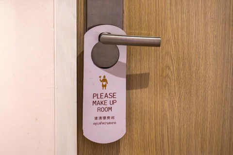 Hotel door trap sign please clean rooms, Bangkok, Thailand