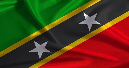 Saint Kitts and Nevis flag with cloth textured background. National flag of Saint Kitts and Nevis