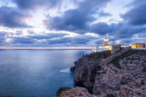View of the Lighthouse of Cabo de Sao Vicente in Sagres, Algarve, Portugal, at evening with wide