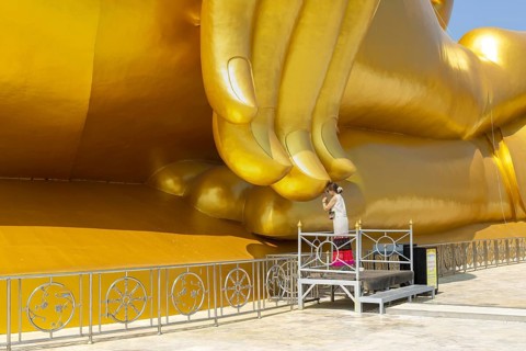 Largest Buddha statue in Thailand (Luang Pho Yai), Thai woman, Wai gesture (traditional gesture of