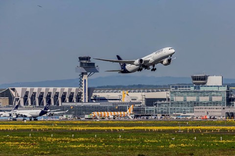 Plane taking off from Fraport Airport in Frankfurt. Tower. FRA, EDDF. Aircraft number plate: