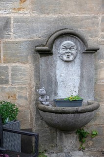 Old fountain at a church, Bamberg, Upper Franconia, Bavaria, Germany