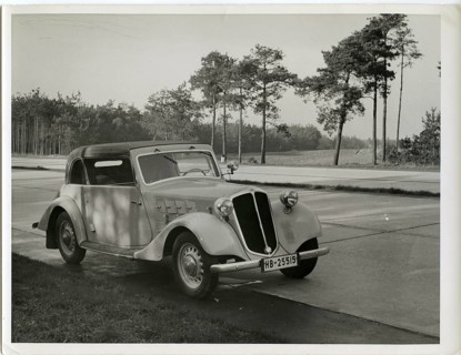 Vintage car, coupé, commercial photo. Reichs-Autobahn, A vintage car parks on the side of the road