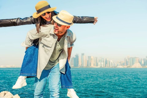 Multiracial beautiful young happy couple of lovers travelers - Multiethnic tourists travelling in