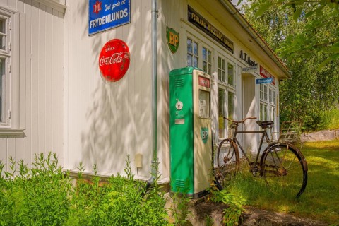 View of an old gas station with an old bicycle parked in front of it, Nedre Eggedal, Buskerud,