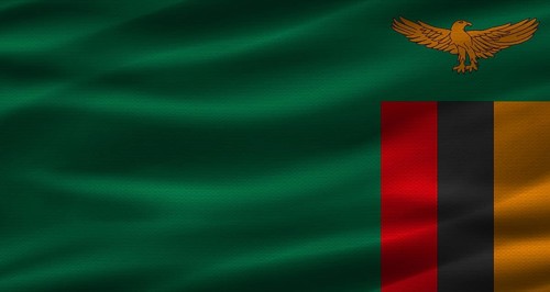 Zambian flag with fabric texture. Realistic flag of Zambia waving