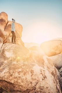 Woman hiking at sunrise in Joshua Tree National Park
