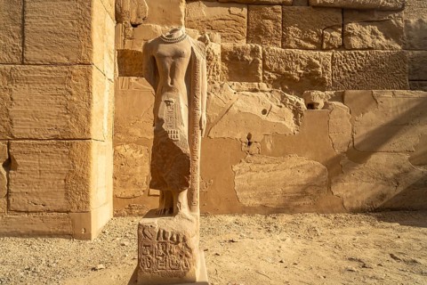 Statue without head in Karnak Temple in Karnak near Luxor, Egypt