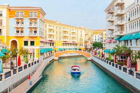 Picturesque canals of Qanat Quartier at The Pearl-Qatar, Doha. Venetian-inspired architecture with