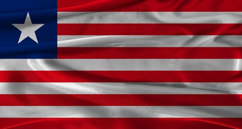 Flag of Liberia with fabric textured background. Close up of National flag of Liberia with