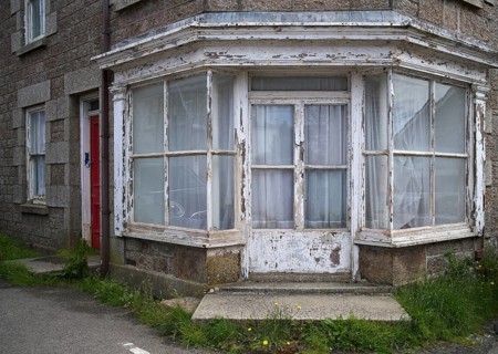 Paint peeling off house façade, window, dilapidated, neglected, dilapidated, St Just in Penwith,