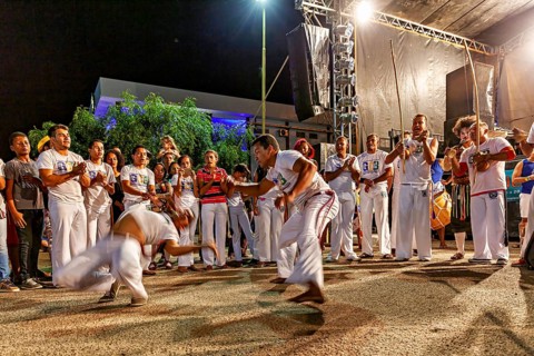 Capoeira performance at night with a crowd admiring martial arts, The Capoeira combat dance at a