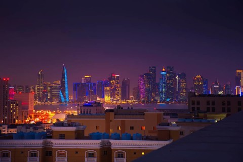 Doha, Qatar - january 8th, 2026: residential area and Doha business hub skyline at night. Iconic