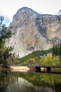 El capitan, a massive granite cliff, dominating the landscape of yosemite valley, with its sheer