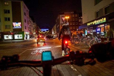 Cycling in the city, in the dark, in the evening, inner-city road, bicycle road, two-wheeler