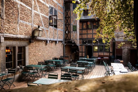 Empty beer garden in a backyard in downtown Liege, Belgium