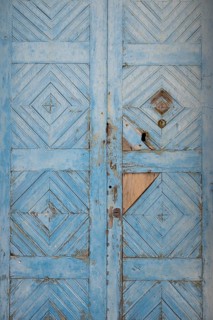 Worn, light blue painted wooden door, Malfa, Salina, Aeolian or Lipari Islands, Southern Italy,