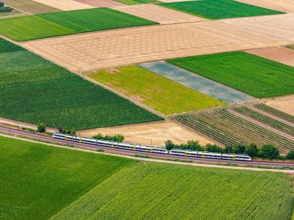DB Regio's regional train runs along the Neckar loop of the Neckar river. Fertile soils and a mild