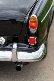 Right rear light and chrome bumper, vintage car, black Volvo Amazon, medium class car from Swedish