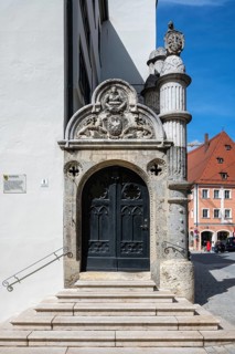 Staircase portal of the town hall of Nördlingen with stonemasonry in the old town of Nördlingen,