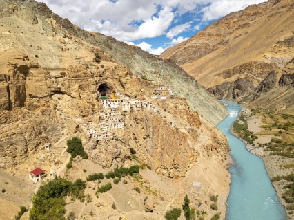 Phugtal Monastery, nestled in the rugged cliffs of the Lungnak Valley, offers a stunning view of