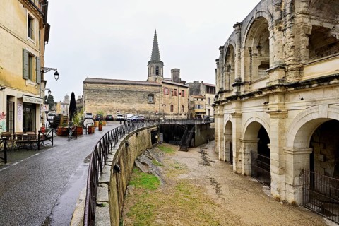 Left Ecole Saint-Charles, right Roman Amphitheatre, Arles, southern France, France