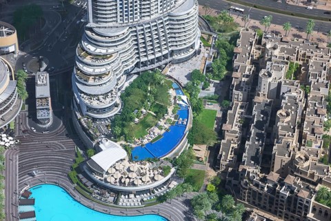 A high-angle view of Burj Lake, and surrounding architecture during a sunny day at the Burj Park