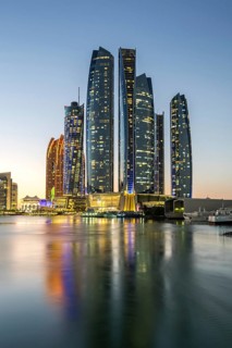 Abu Dhabi Skyline Etihad Towers skyscrapers at night in Abu Dhabi, United Arab Emirates
