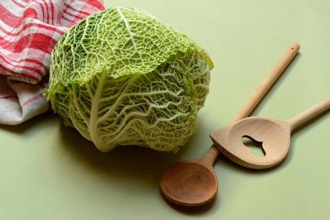 Savoy, savoy cabbage with cooking spoon