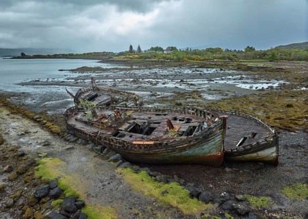 Drone photo of a ship's wreck on the shore of Isle of Mull, Tobermory, Scotland, UK